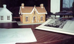 Gingerbread House on Display with Historic Ducmentation